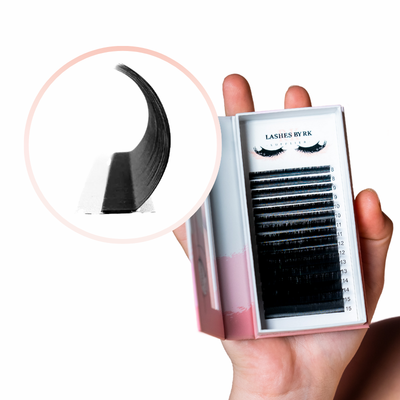 Eyelash packaging with a close-up of individual lashes  LC curl held by a hand on a white background.