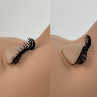False eyelashes on a mannequin eye with a neutral background
